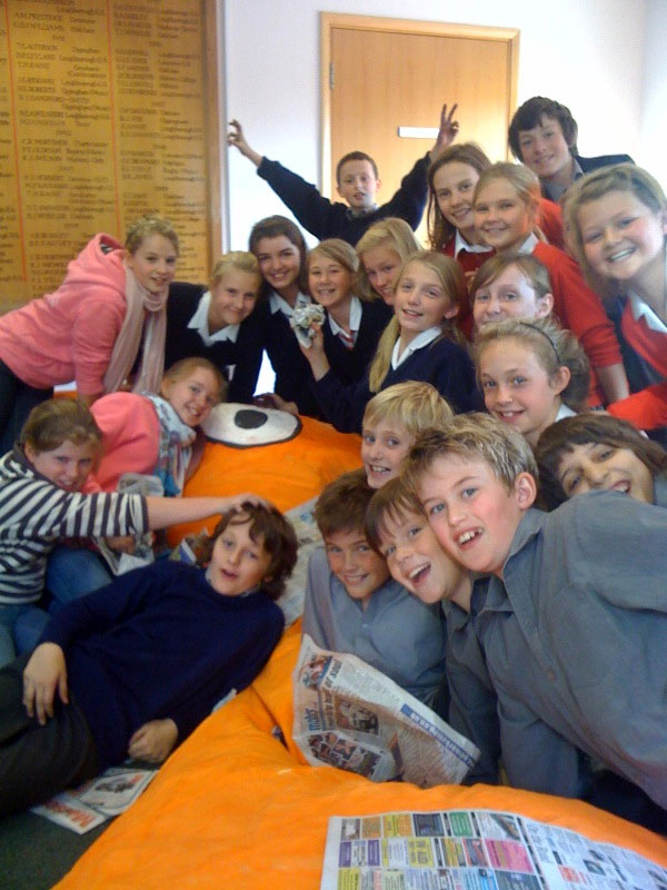 Some children enjoying doing their bit of stuffing!